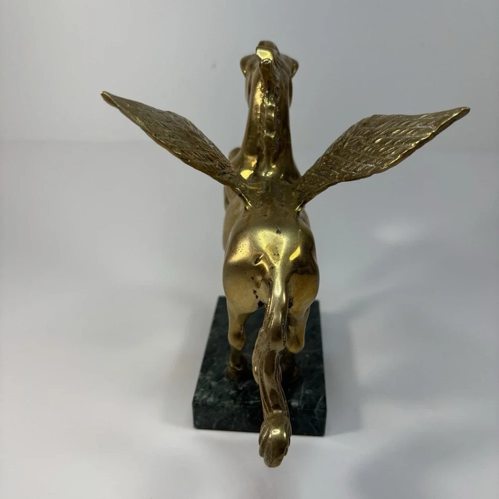vintage solid brass Pegasus figurine mounted on a green marble base,